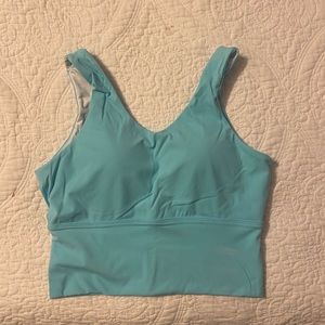 NVGTN sports top in powder blue. Gently used a couple of times.